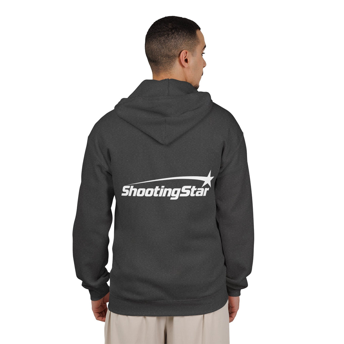 Back view of a man wearing a dark gray fabric zip-up hoodie with a white Shooting Star graphic printed on the back.